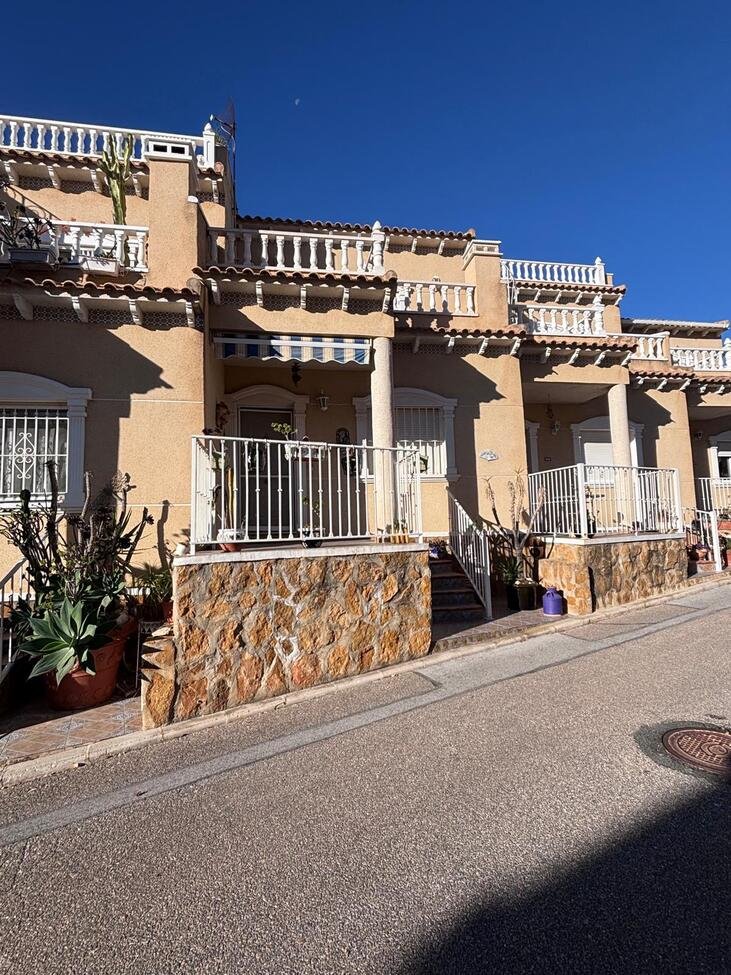   Charming Two-Bedroom Townhouse in Villamartin
This lovely two-bedroom townhouse is situated within a secure gated community in the sought-