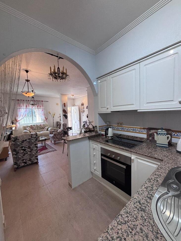   Charming Two-Bedroom Townhouse in Villamartin
This lovely two-bedroom townhouse is situated within a secure gated community in the sought-