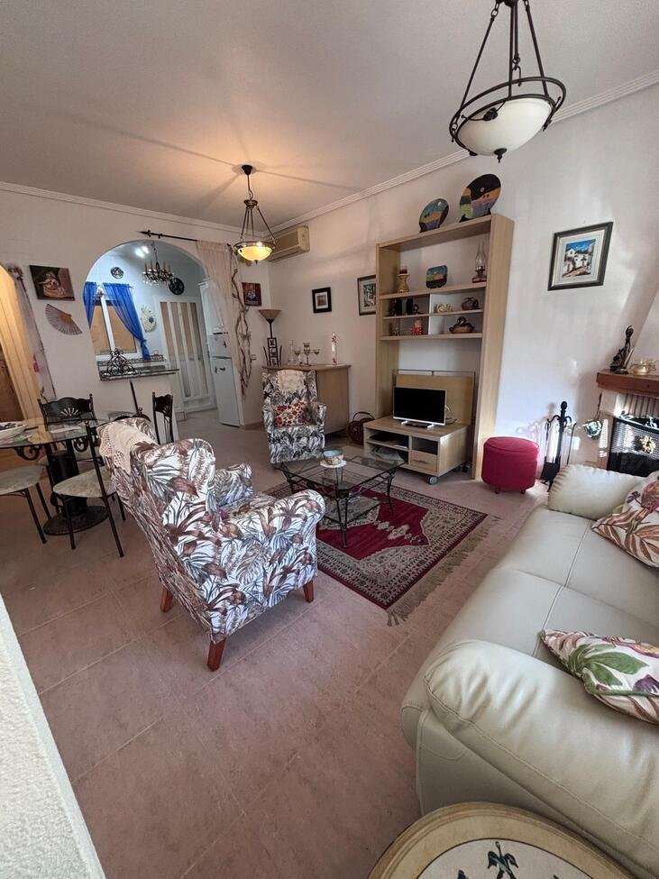   Charming Two-Bedroom Townhouse in Villamartin
This lovely two-bedroom townhouse is situated within a secure gated community in the sought-