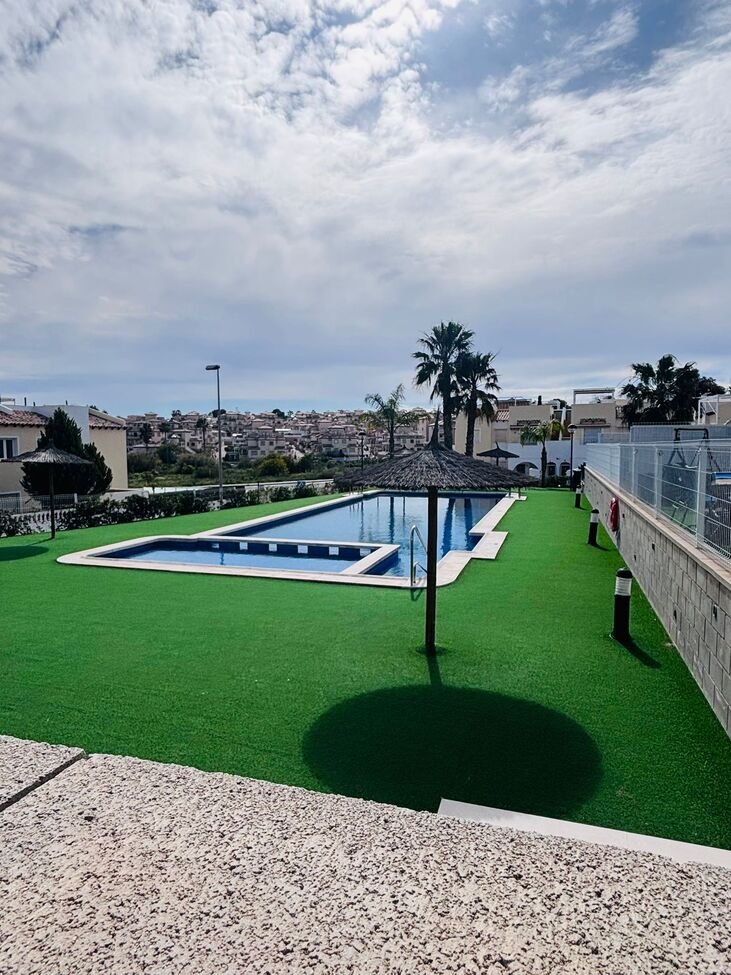   Beautifully presented second-floor apartment offering 2 bedrooms and 2 bathrooms, located in a sought-after gated community near Villamartin Plaza.&