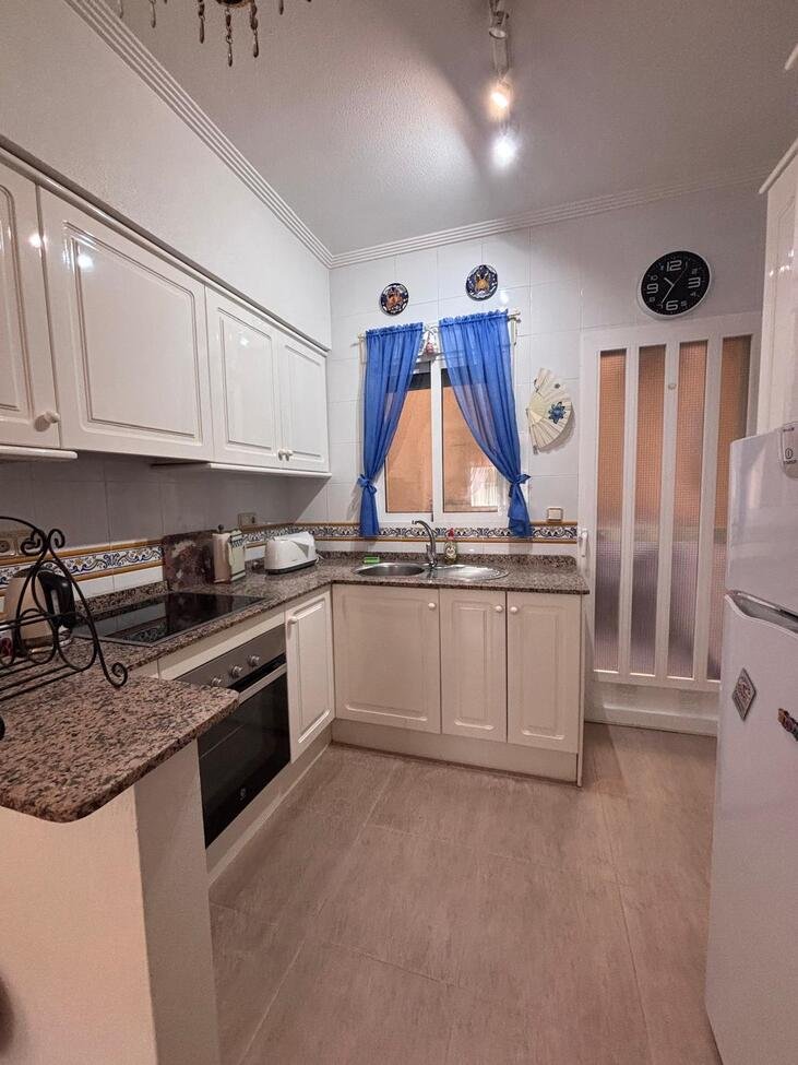   Charming Two-Bedroom Townhouse in Villamartin
This lovely two-bedroom townhouse is situated within a secure gated community in the sought-