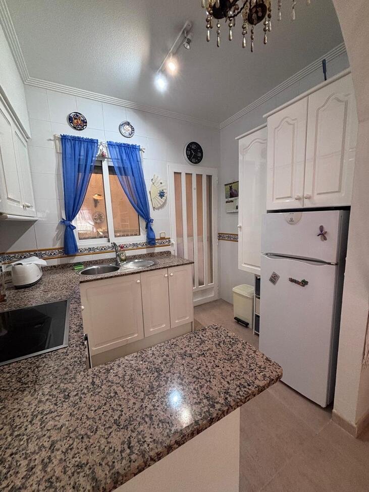   Charming Two-Bedroom Townhouse in Villamartin
This lovely two-bedroom townhouse is situated within a secure gated community in the sought-