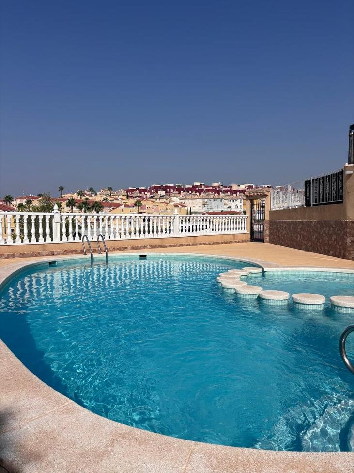   Charming Two-Bedroom Townhouse in Villamartin
This lovely two-bedroom townhouse is situated within a secure gated community in the sought-