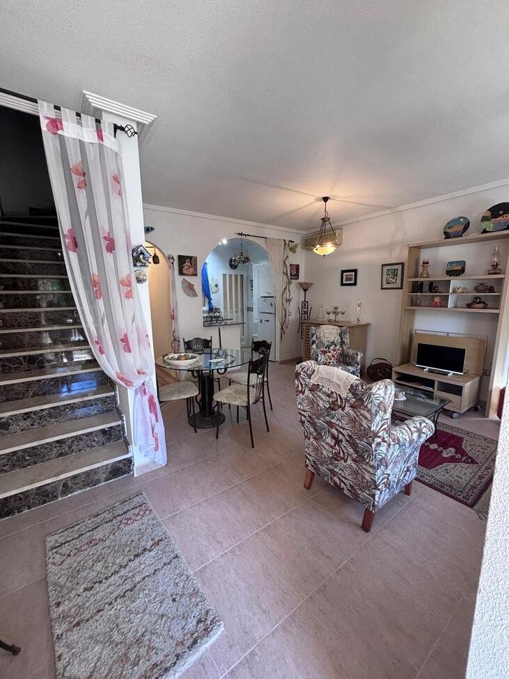   Charming Two-Bedroom Townhouse in Villamartin
This lovely two-bedroom townhouse is situated within a secure gated community in the sought-