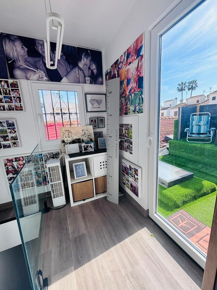 Located in the heart of the vibrant town of San Miguel de Salinas in the beautiful Alicante Province, this fully renovated four-bedroom townhouse of