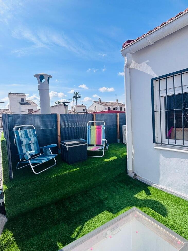 Located in the heart of the vibrant town of San Miguel de Salinas in the beautiful Alicante Province, this fully renovated four-bedroom townhouse of