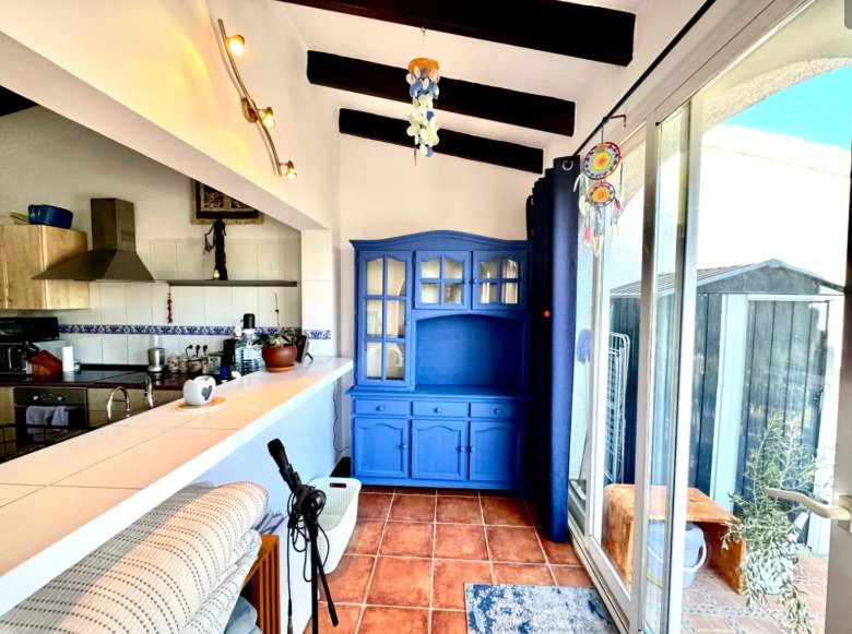 A delightful duplex townhouse only 1.8 km from Moraira centre. set on a small and incredibly pretty complex of 13 houses with a communal pool and be