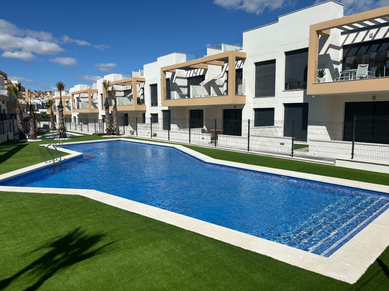 Orihuela Costa:   This South Facing, Two Bedroom, Top Floor Corner Apartment is located within a 10 minute walk of a main chain supermarket, JYSK furniture store, and 