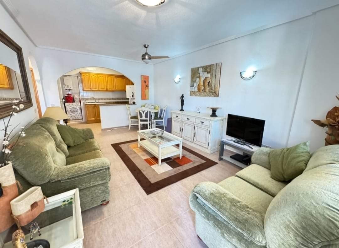 Enjoy the best of the Costa Blanca in this charming ground-floor apartment, ideally situated in the popular Villamartin. This move-in ready property