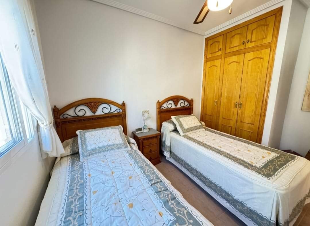 Enjoy the best of the Costa Blanca in this charming ground-floor apartment, ideally situated in the popular Villamartin. This move-in ready property