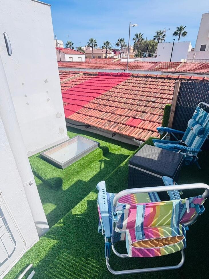 Located in the heart of the vibrant town of San Miguel de Salinas in the beautiful Alicante Province, this fully renovated four-bedroom townhouse of