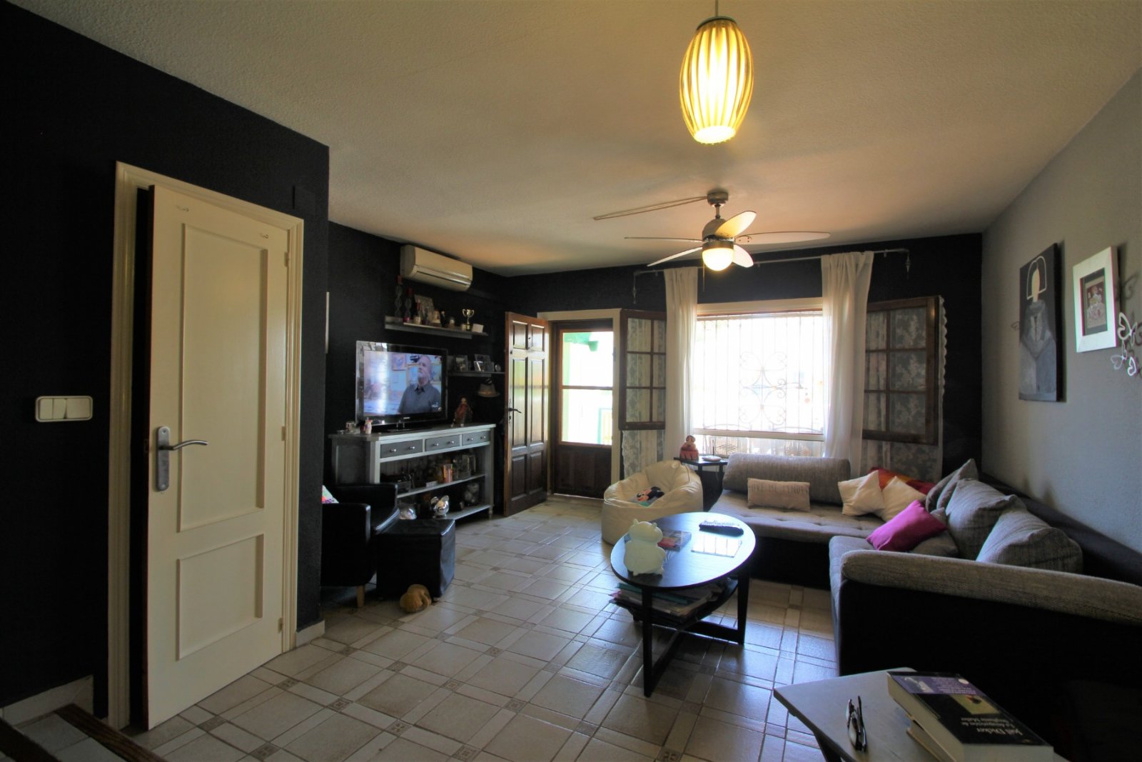 An ideally positioned townhouse with large living dining area, with separate kitchen and guest toilet on ground floor.  2 bedrooms and