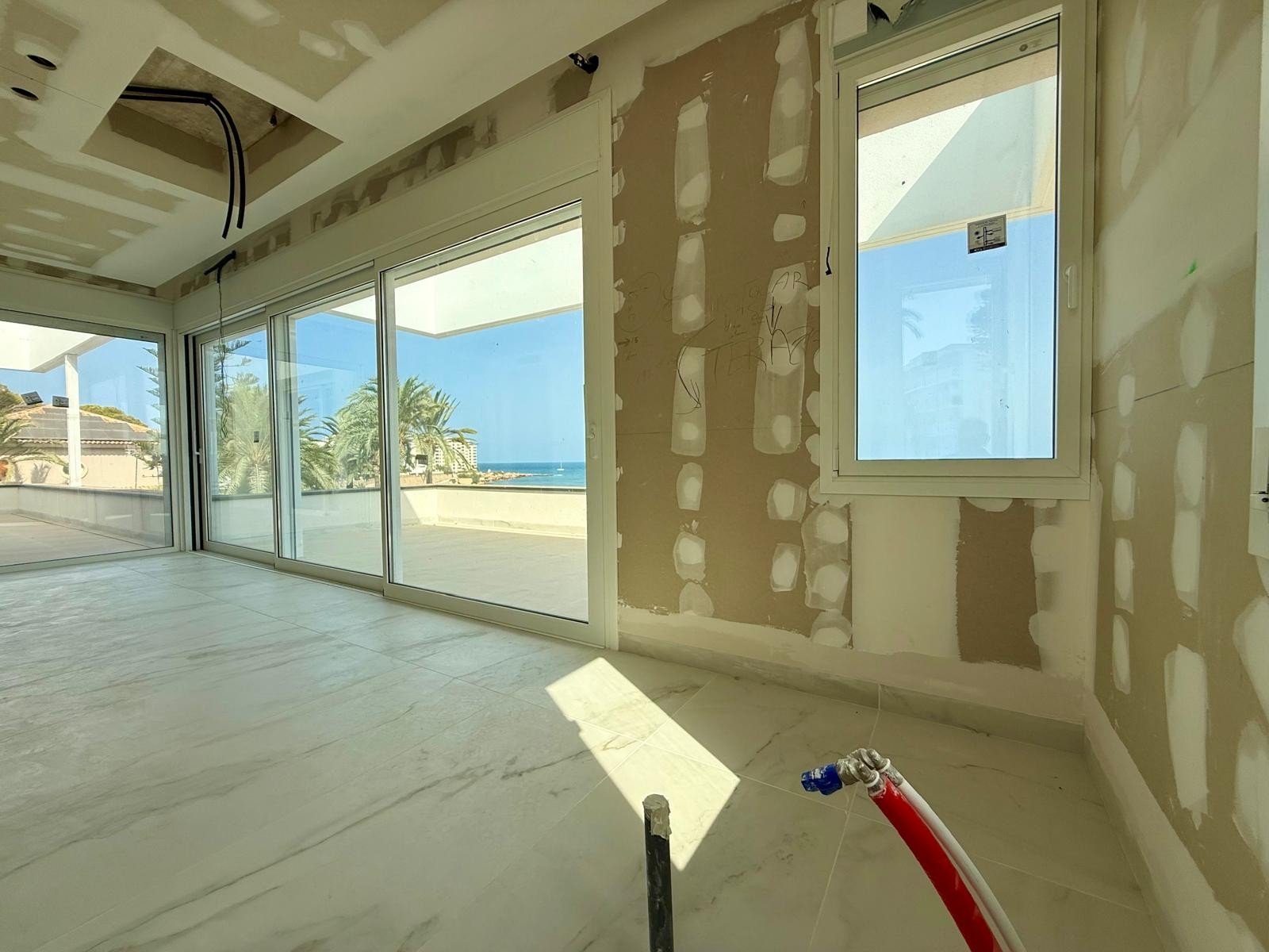   First line luxury villa under construction in Punta Prima
The first line plot of 1100 m2 with superb views over the Mediterranean sea 
