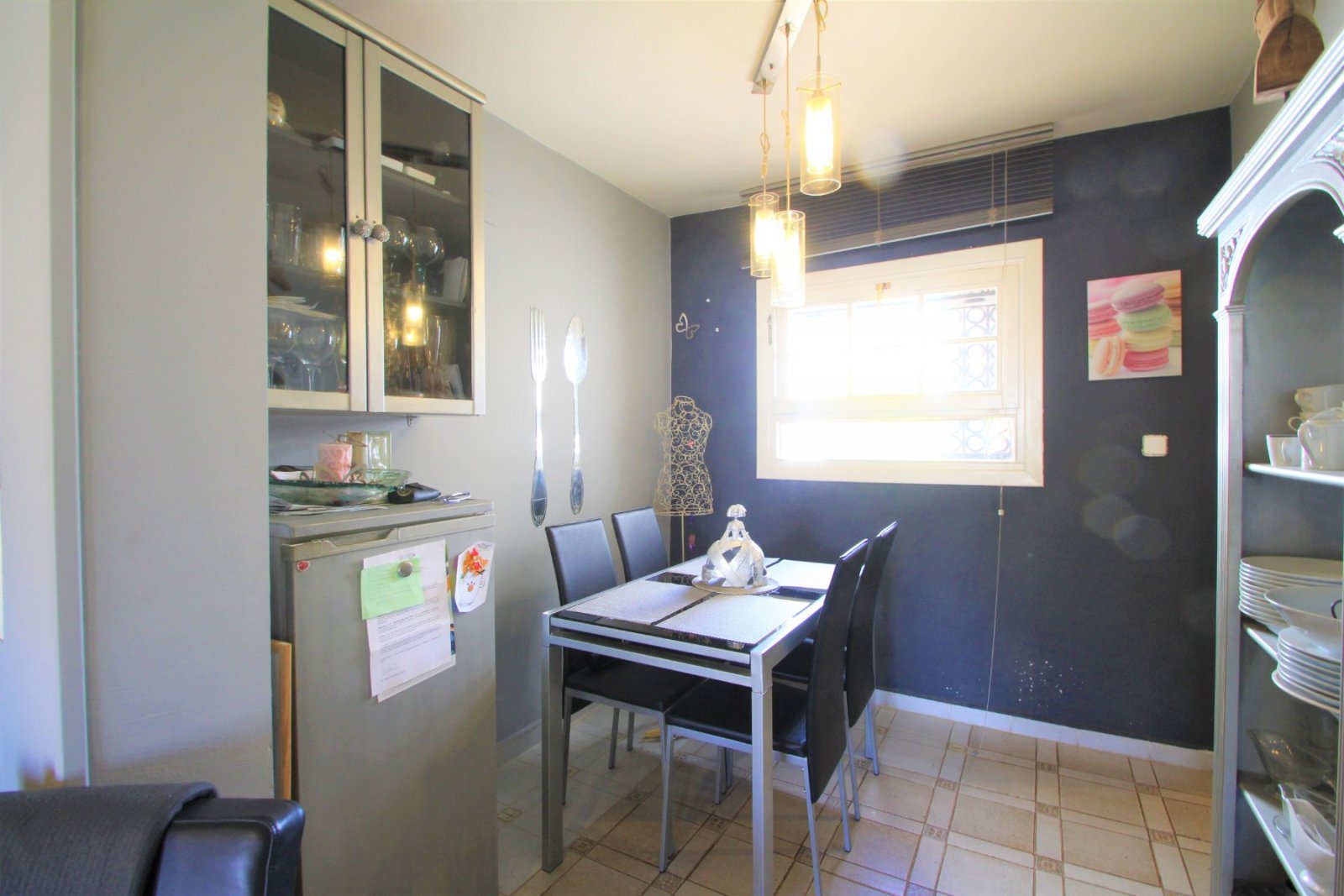 An ideally positioned townhouse with large living dining area, with separate kitchen and guest toilet on ground floor.  2 bedrooms and