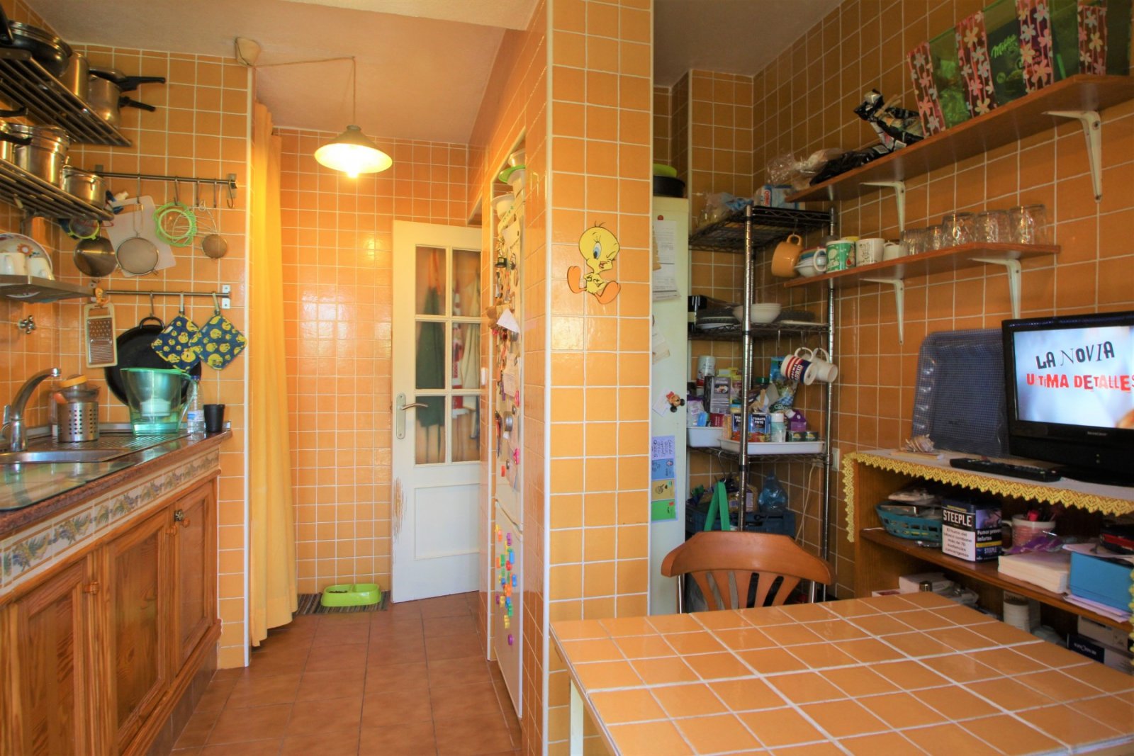 An ideally positioned townhouse with large living dining area, with separate kitchen and guest toilet on ground floor.  2 bedrooms and