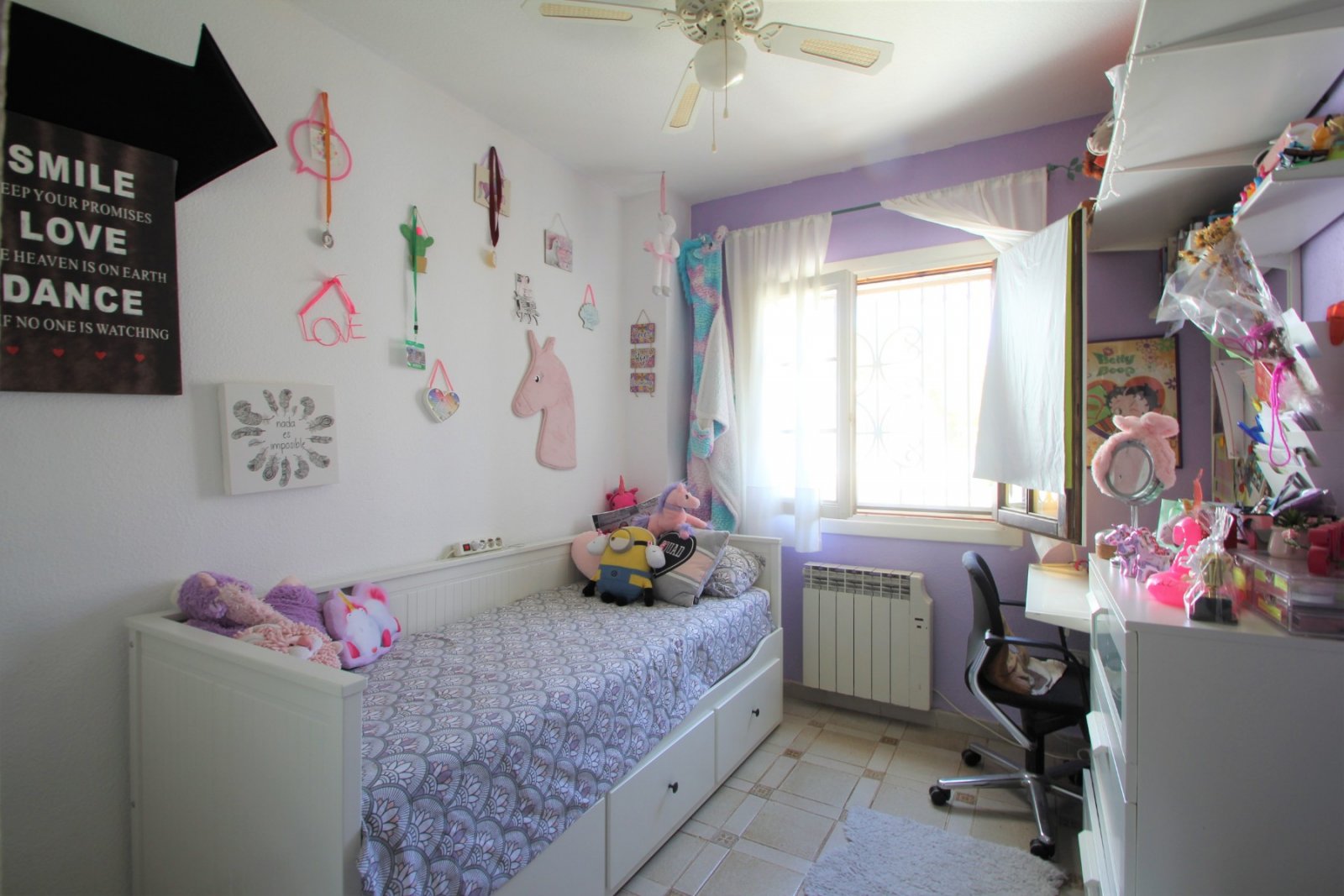 An ideally positioned townhouse with large living dining area, with separate kitchen and guest toilet on ground floor.  2 bedrooms and