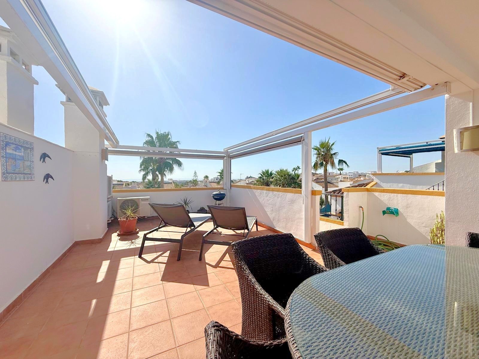   This apartment has lovely views over the communal pool and garden area along with views down to the sea from its south facing balcony and roof terra