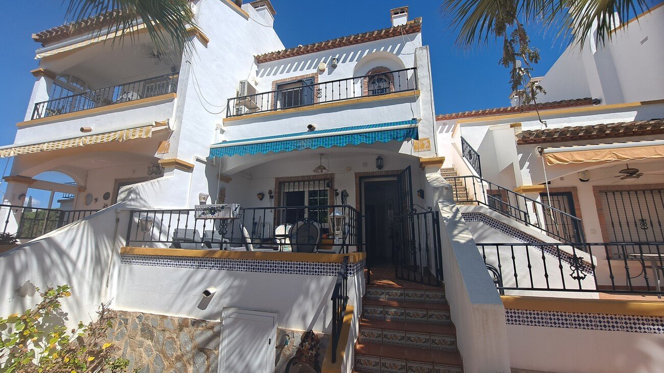 Los Dolses:   This well-proportioned townhouse offers excellent outdoor space, a practical layout, and a superb location. With a communal swimming pool and easy a 