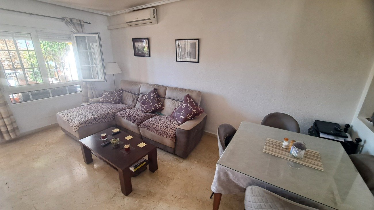 This well-proportioned townhouse offers excellent outdoor space, a practical layout, and a superb location. With a communal swimming pool and easy a