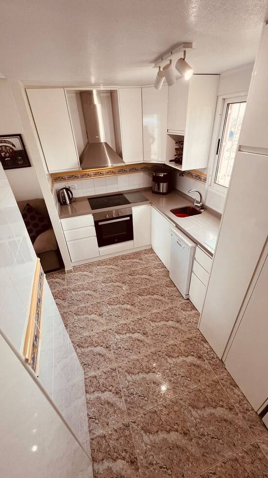 This beautifully renovated first-floor apartment is ideally situated in the sought-after area of Villamartin, offering a fantastic combination of mo