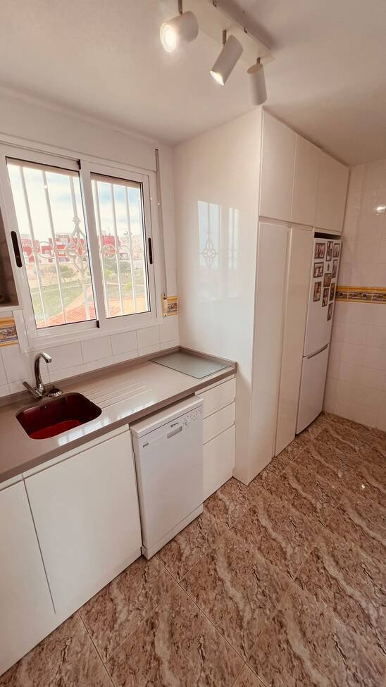This beautifully renovated first-floor apartment is ideally situated in the sought-after area of Villamartin, offering a fantastic combination of mo