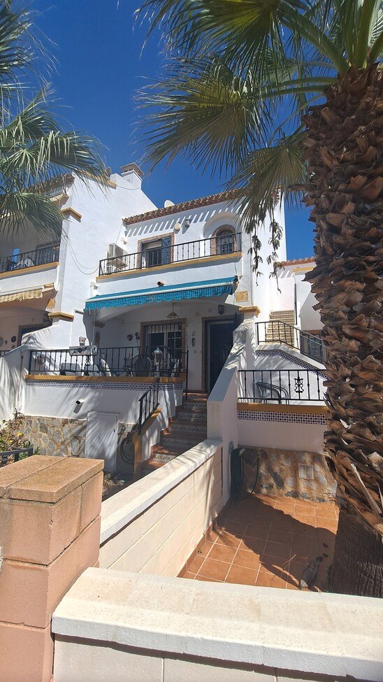 This well-proportioned townhouse offers excellent outdoor space, a practical layout, and a superb location. With a communal swimming pool and easy a