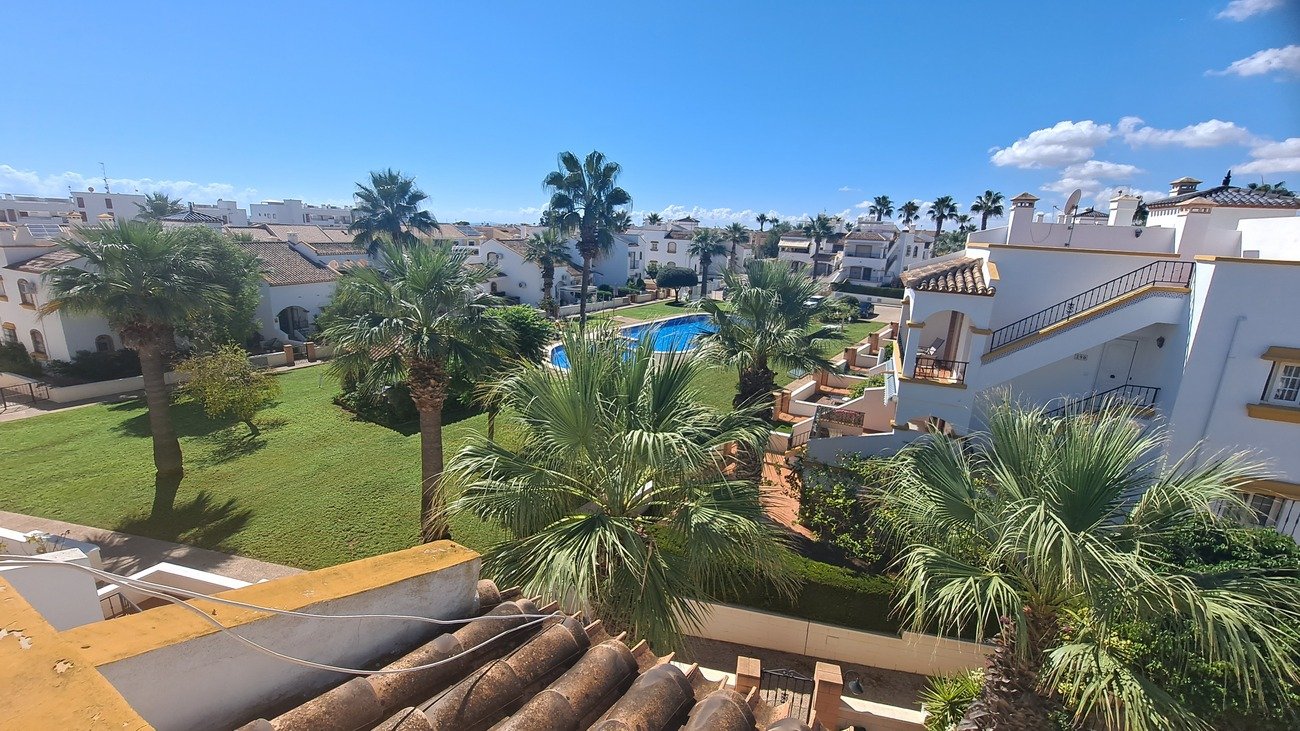 This well-proportioned townhouse offers excellent outdoor space, a practical layout, and a superb location. With a communal swimming pool and easy a