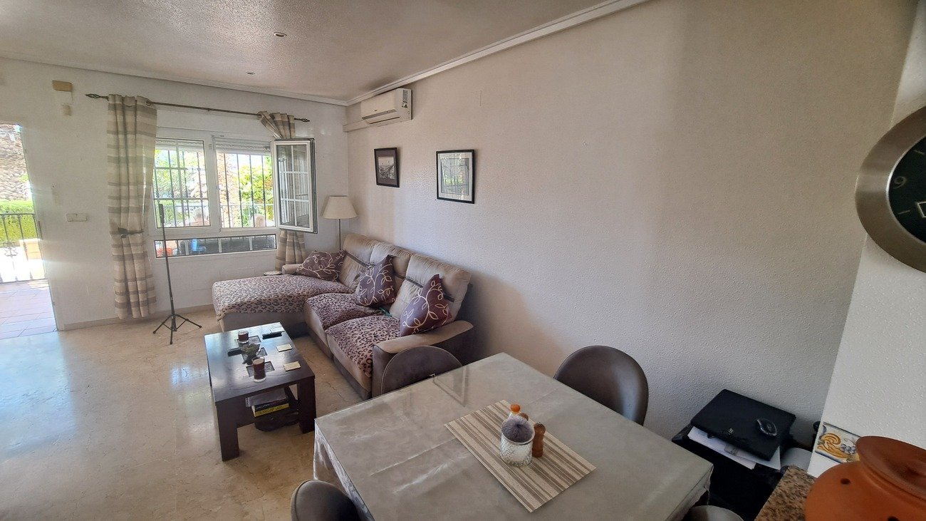 This well-proportioned townhouse offers excellent outdoor space, a practical layout, and a superb location. With a communal swimming pool and easy a
