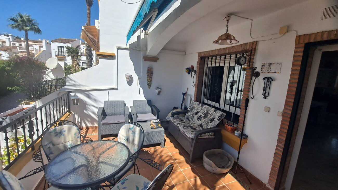 This well-proportioned townhouse offers excellent outdoor space, a practical layout, and a superb location. With a communal swimming pool and easy a